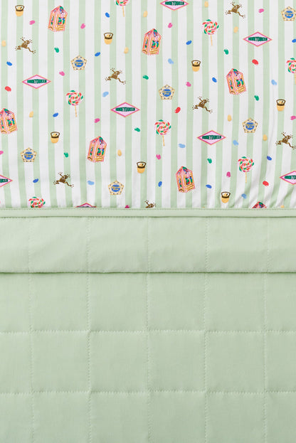 Baby blanket with colorful Harry Potter patterns print on a green and white striped fabric with light green fabric at the back.
