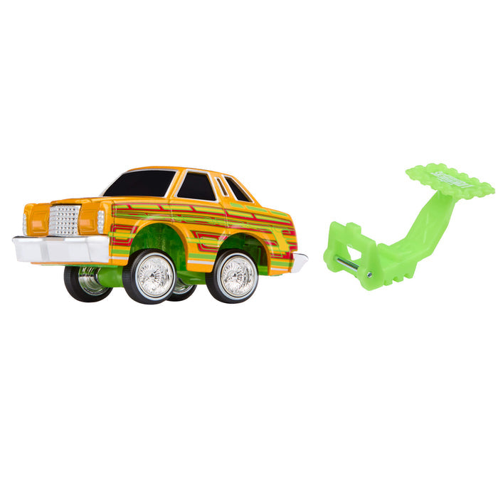 Toy car with a green tool on a white background