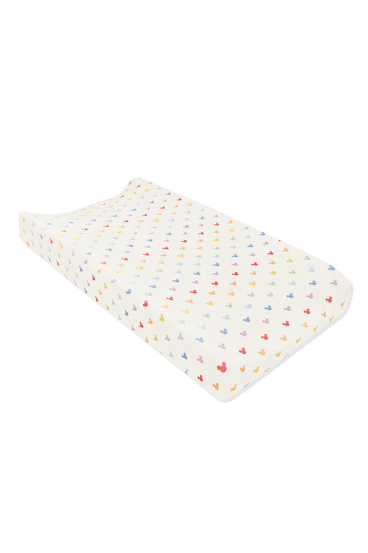 Change pad cover with pastel mickey mouse pattern on an oat background