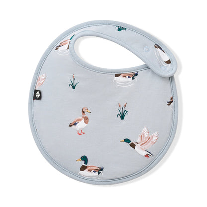 Front of the Cushy Bib in Mallard Duck with the black Kyte baby logo visible