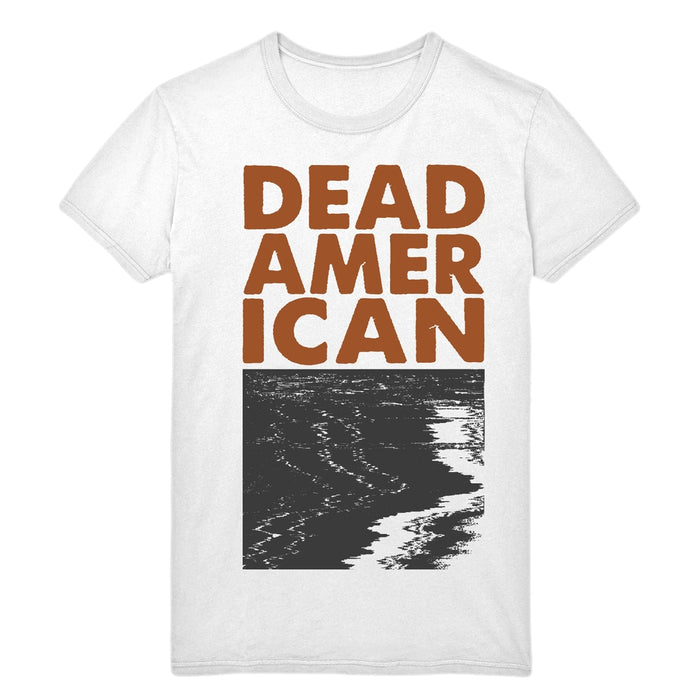 White short sleeve shirt with text that says DEAD AMERICAN. Below that is a glitchy black and white image.