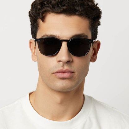 lifestyle - diff eyewear featuring the jaxson xl square oversized sunglasses with a black frame and grey prescription lenses angled view
