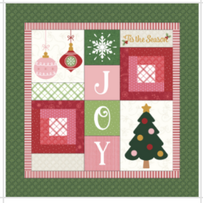 Christmas-themed patchwork design with 'JOY' and tree on a green background