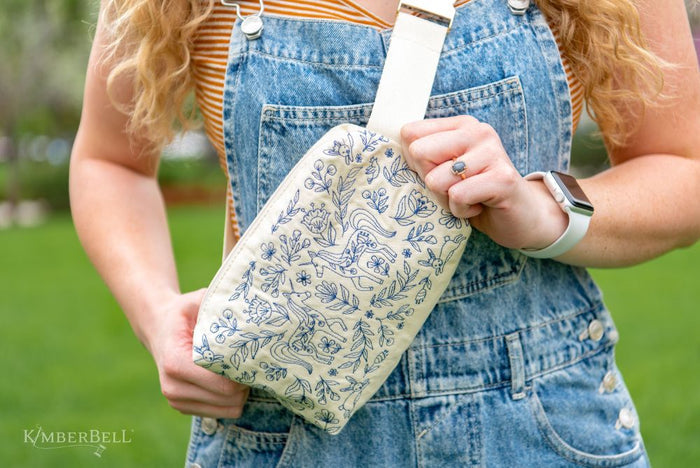 Canvas cream zipper pouch with blue embroidery designs