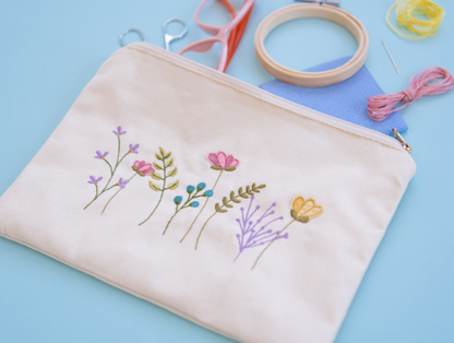 Canvas cream zipper pouch with embroidered flowers