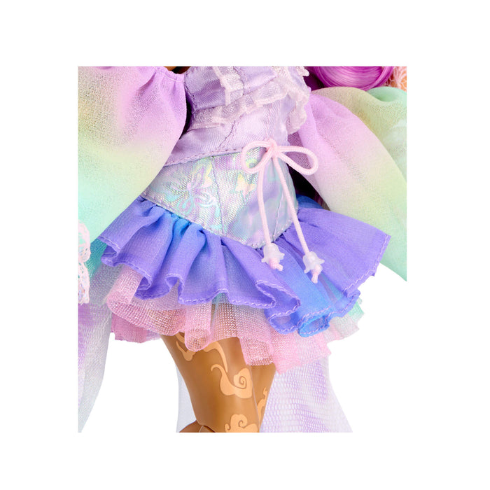 A close-up of a pastel dress on a doll, featuring a ruffled purple and blue skirt.