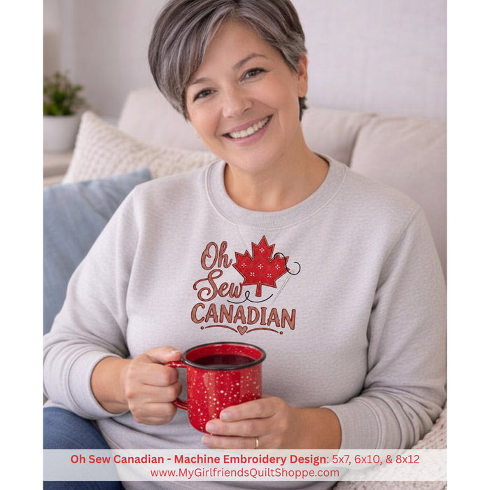 Woman wearing a 'Oh Sew Canadian' sweatshirt holding a red mug.