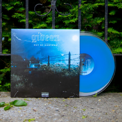 A Clear W/ Neon Blue LP from Gideon partially slides out of the Out Of Control album cover, featuring a dark landscape with a fence, car, moonlit sky, and set against leafy green scenery.