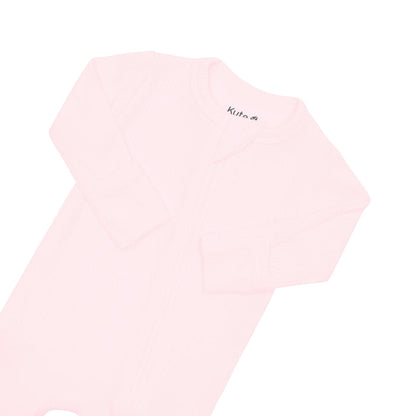 Fold-over cuffs on Kyte Baby Ribbed Zippered Footie in Sakura