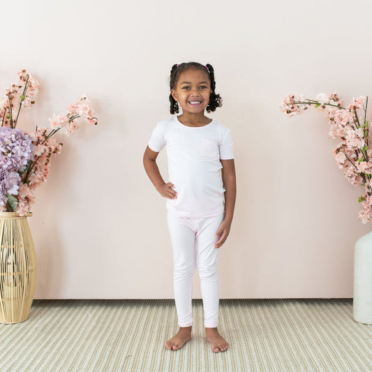 Toddler wearing Kyte Baby Short Sleeve with Pants Pajamas in Sakura