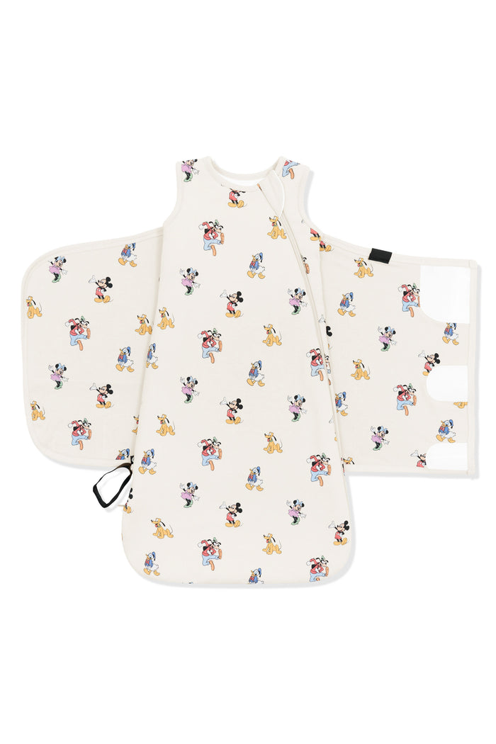 Front of Sleep Bag Swaddler in Mickey Mouse and Friends print on an oat background