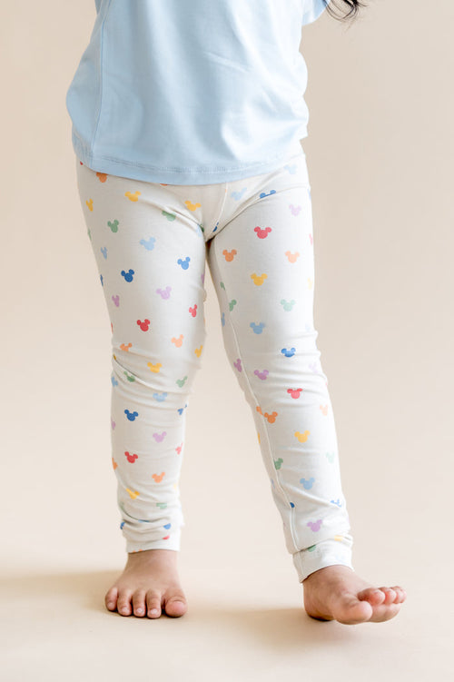 child wearing colorful mickey head pattern leggings