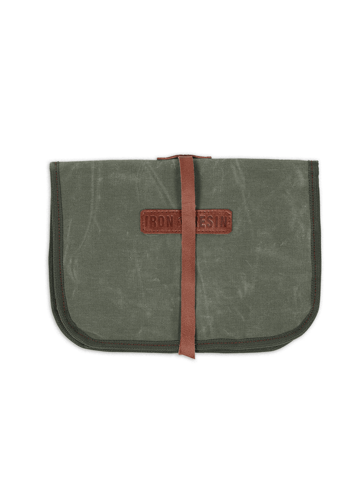 Green canvas pouch with a brown leather strap and "Iron and Resin" logo, designed for carrying tools or accessories.